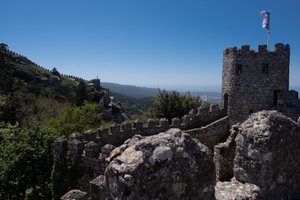 A view of one corner of the Castle of the Moors with fortified walls receding in to the distance.
