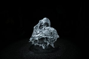 A round shower of water is frozen in mid air by strobe lighting.